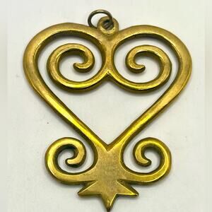 Adrinka Sankofa brass “Go Back and Get it” pendant